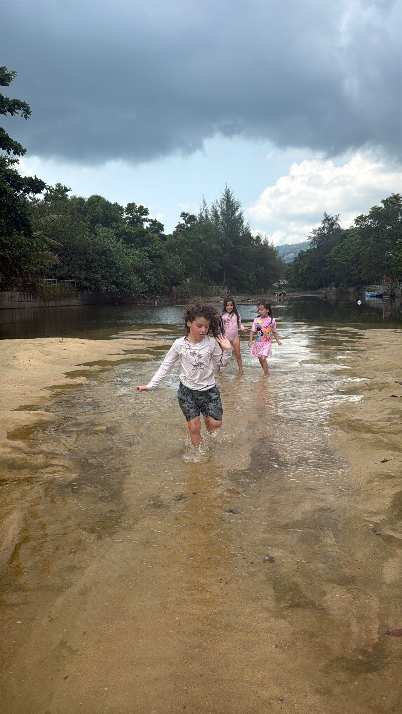 Event flyer: Kids playing in shallow water